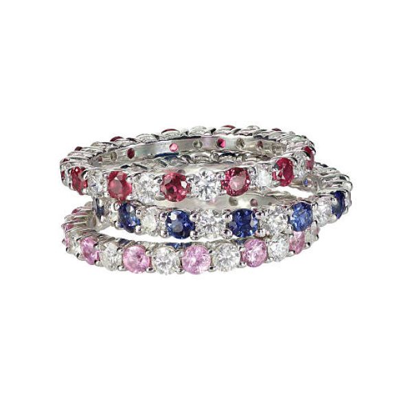 Diamond gemstone rings stacked together bridal wedding and engagement setting isolated on white